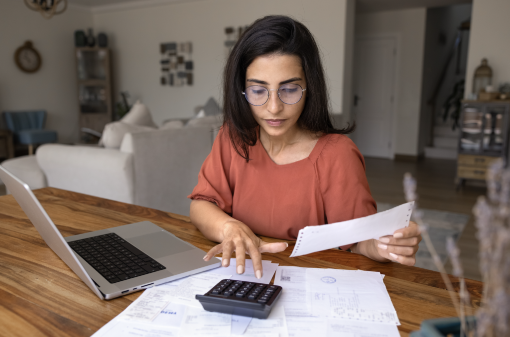 Renter calculating 3x the rent income requirement before applying for an apartment.
