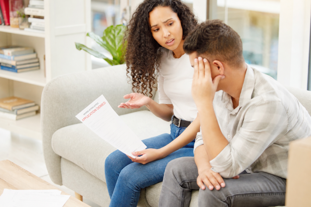 Renter reviewing an adverse action notice after an apartment application denial.