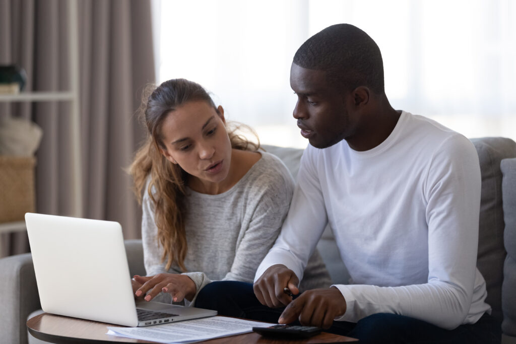 Renter reviewing bank statements before submitting apartment application documents to a landlord.
