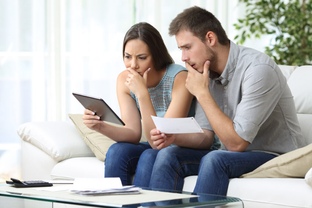 Renters comparing bad credit and no credit while preparing apartment application documents.
