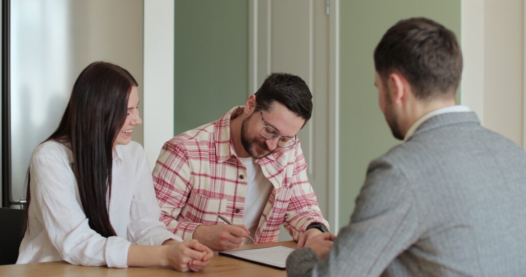 Renter and co-signer signing an apartment lease together.