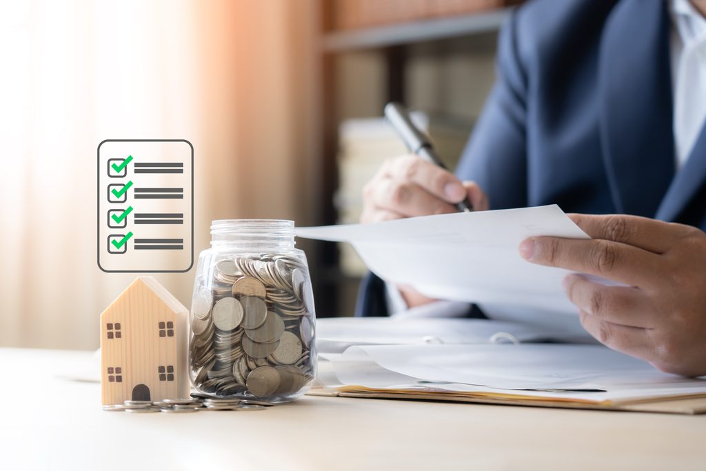 First-time home buyer reviewing a step-by-step checklist from credit and mortgage pre approval through inspection and closing day.