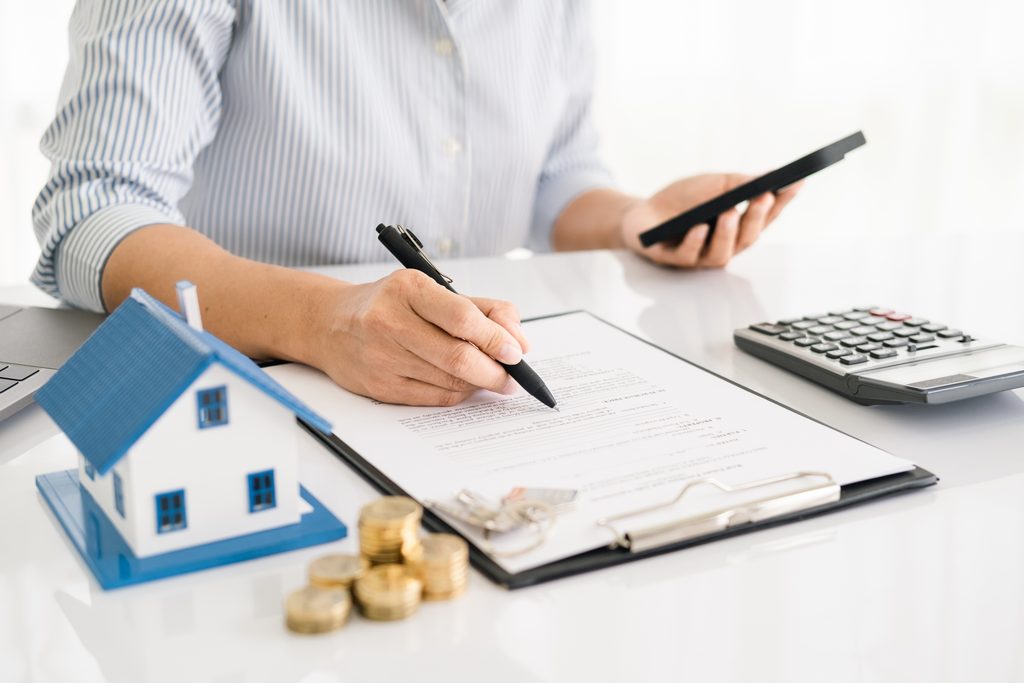 Renter reviewing a rent-to-own home agreement and planning a future home purchase.